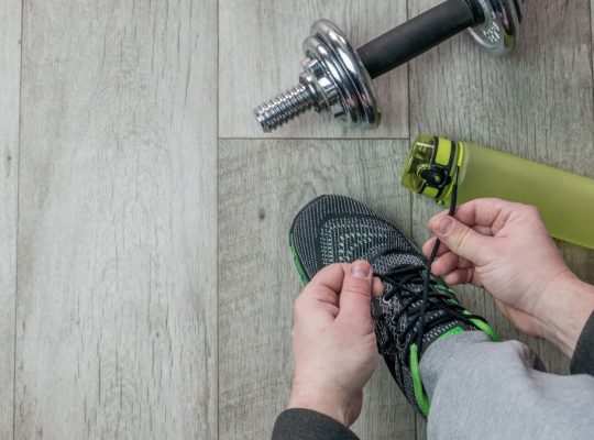 Fitness objects isolated on wooden background. Gray Sneakers, dumbbells and water bottle. Active, healthy lifestyle, sport, fitness, and objects concept. More of my photos and videos Adobe Stock:http://bit.ly/3RqlciK More of my photos and videos Shutterstock: https://www.shutterstock.com/g/ALEKSANDRBERDYUGIN My email: bermix999@gmail.com